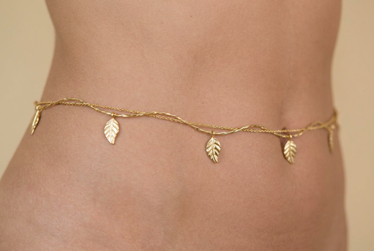 Entwined — gold waist chain with vine and leaf pendants